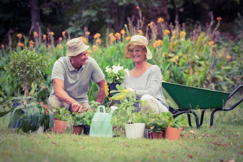 Professional gardener removing weeds in Norwood garden